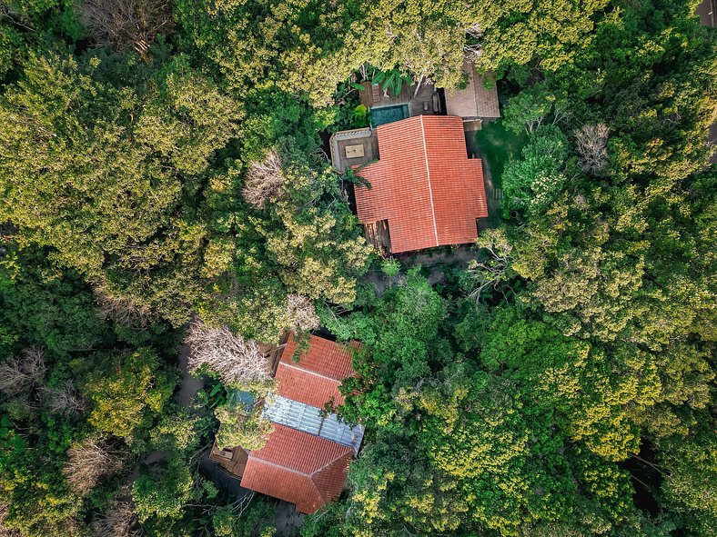 Casa Caqui Trancoso - Cravejada em reserva natural